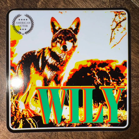 Sticker: Coyote - Wily by American Lictor features a striking coyote image with “WILY” in green, a laurel wreath, and an AMERICAN LICTOR badge. Ideal 3x3 sticker for forbidden doggo fans.