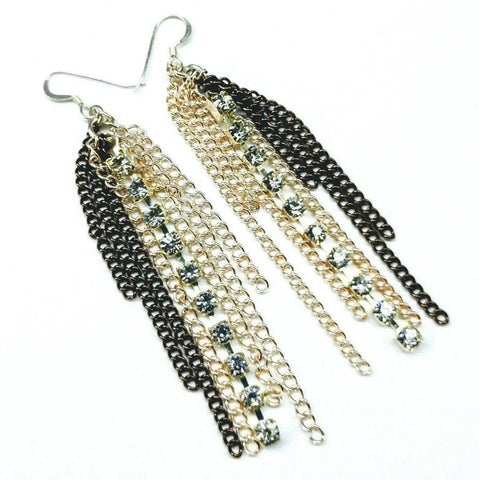 The Alexa Martha Designs Rhinestone Crystal Chain Fringe Earrings feature gold and black chains with sparkling rhinestones in a layered, elegant design.