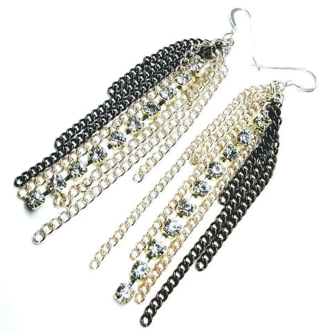 The Rhinestone Crystal Chain Fringe Earrings by Alexa Martha Designs feature black and gold chains, silver hooks, and sparkling rhinestone strands in a layered fringe style.