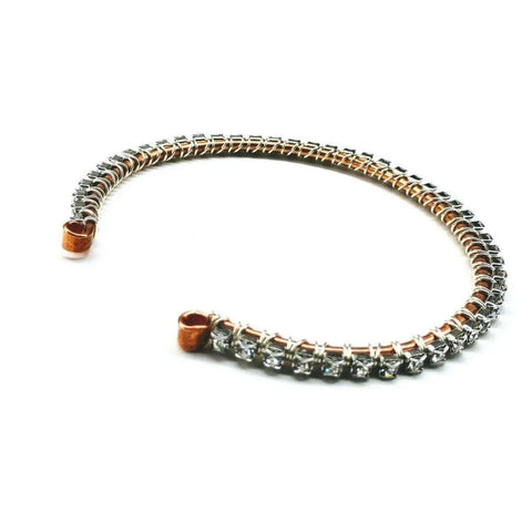 The Wire Wrapped Crystal Rhinestone Tennis Bracelet Bangle by Alexa Martha Designs adds sparkling elegance to any outfit with its dazzling rhinestones.