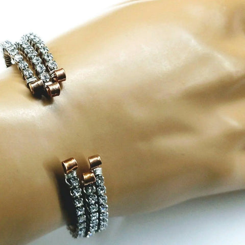 A close-up shows a wrist wearing the Alexa Martha Designs Wire Wrapped Crystal Rhinestone Tennis Bracelet Bangle, featuring three rows of sparkling beads and adjustable open copper ends for a textured, elegant look.
