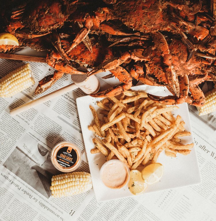 Fried clams and corn on a newspaper background