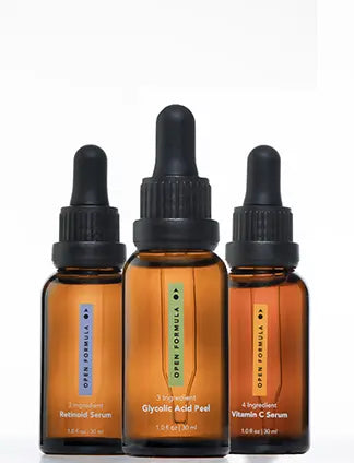 Three amber glass dropper bottles from Open Formulas Dark Spot Remover Superset, each with a black dropper cap, are designed to target hyperpigmentation and dark spots. They stand upright against a white background.