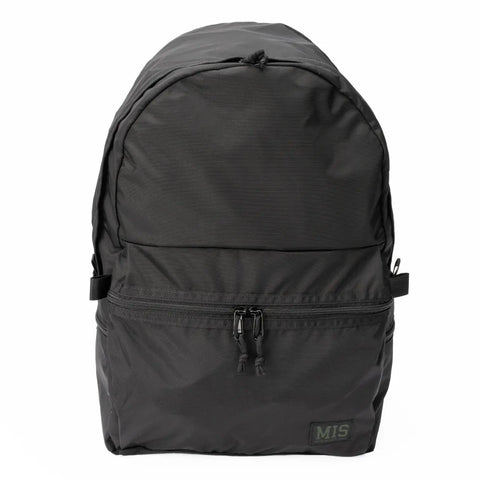 The MIS Daypack Plus Gen2 in black features a spacious main compartment, front zip pocket, double zipper pulls, and a small MIS patch on the lower right. The backpack stands upright against a white background.