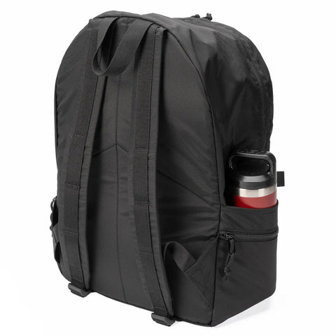 The MIS Daypack Plus Gen2 - Black is shown from the back, featuring padded shoulder straps, a spacious main compartment, and a small side pocket holding a red and silver travel mug.