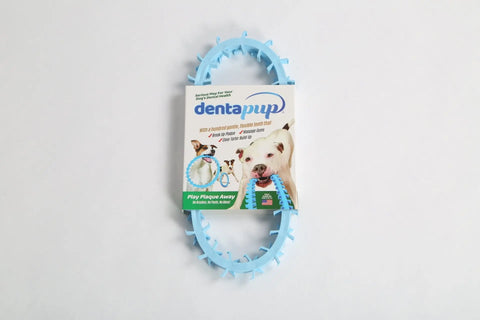 Dentapup Dog Dental Toy - Blue by Dentapup is an oval-shaped toy shown encircling its packaging, with a dog biting the toy and text highlighting oral hygiene and dental health benefits for dogs.