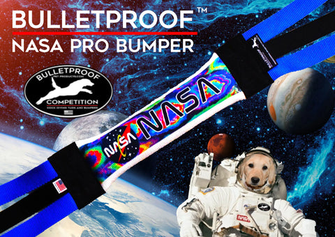 The Bulletproof Pet Products Inc Dock Diving Bumper Tug – Competition Series Weighted – features NASA-themed planets, stars, and an astronaut dog. Text reads BULLETPROOF NASA PRO BUMPER and BULLETPROOF COMPETITION. Customizable—ideal for dock diving.