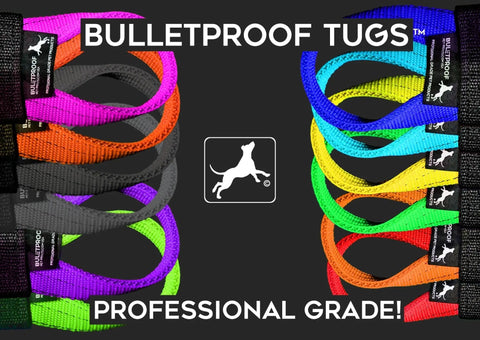 Six vibrant Bulletproof Pet Products Inc tugs, including the customizable Dock Diving Bumper Tug - Competition Series Weighted, are arranged beside a black backdrop with a white dog logo and BULLETPROOF TUGS PROFESSIONAL GRADE! at center.
