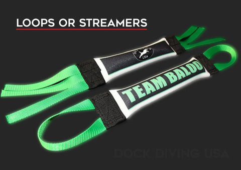 Two customizable black, white, and green Dock Diving Bumper Tug - Competition Series Weighted toys by Bulletproof Pet Products Inc with TEAM BALDO labels, green loops and streamers on a dark background. LOOPS OR STREAMERS text shown above.