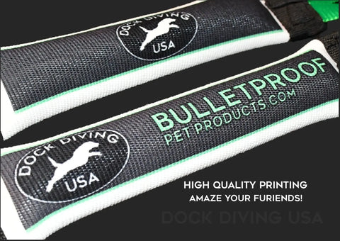 Close-up of two black and white Dock Diving Bumper Tug - Competition Series Weighted by Bulletproof Pet Products Inc, labeled “DOCK DIVING USA” with a jumping dog silhouette and “HIGH QUALITY PRINTING AMAZE YOUR FRIENDS!”.
