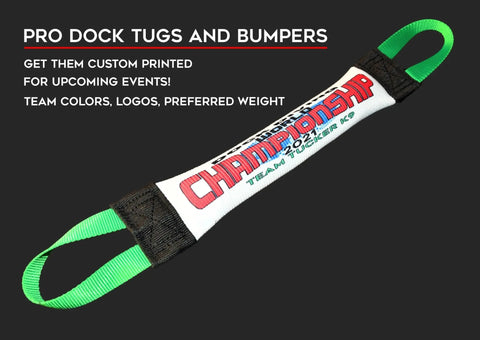A promotional image for Bulletproof Pet Products Inc’s Dock Diving Bumper Tug – Competition Series Weighted – Customizable, featuring a white bumper with green handles and “CHAMPIONSHIP 2021 TEAM TUCKER KC” in red, blue, and black text.