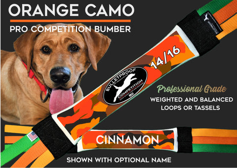 Close-up of a brown dog in a red collar with the Bulletproof Pet Products Inc Dock Diving Bumper Tug—Competition Series Weighted, New Orange Camo, Hybrid with loops—labeled 14/16 and CINNAMON. Perfect dock diving accessory with optional name tag.