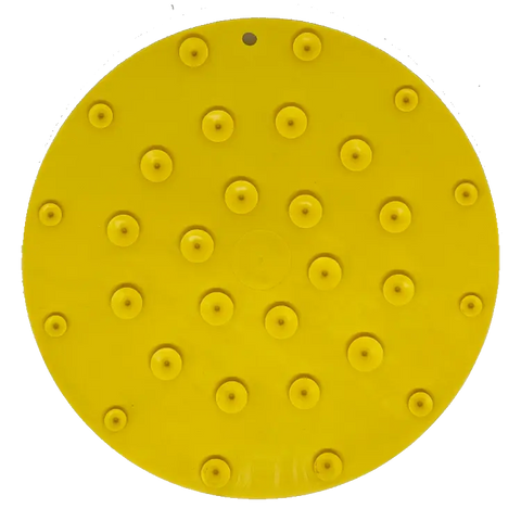 The SodaPup Duckies Design EMat Enrichment Lick Mat With Suction Cups is a round, yellow disc with raised bumps and suction cups, designed to make dog bath time more enjoyable and stress-free.