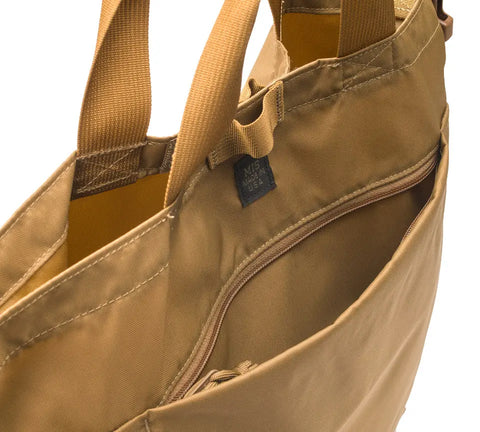 A close-up of the MIS 2 Way Shoulder Bag in Coyote Brown shows sturdy handles, a zipper pocket, and an inner MIS USA label—showcasing its water-resistant quality and USA-made craftsmanship.