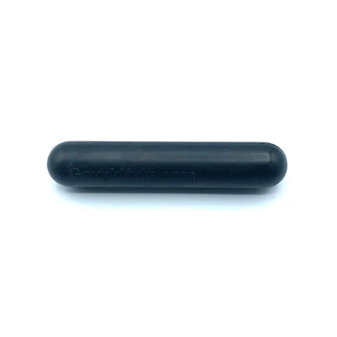 The Goughnuts .75 Black Stick - Power Chewer is a black, cylindrical dog chew toy with rounded ends, embossed with GoughNuts.com and backed by the Goughnuts Guarantee for durability. Perfect for tough chewers.
