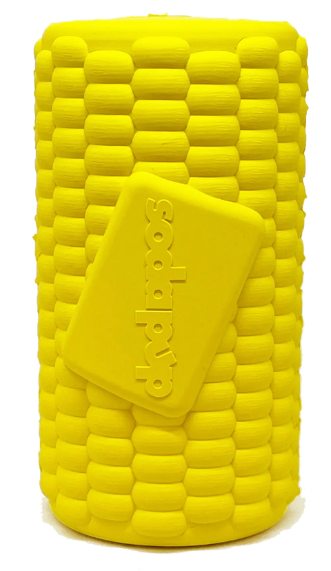 The SodaPup Corn on the Cob EDispenser is a bright yellow, corn-shaped durable rubber treat dispenser with a rectangular lid embossed sodapop and a textured cob surface for extra fun.