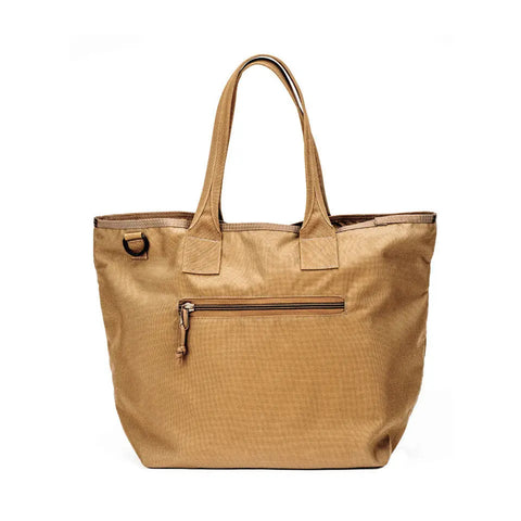 The MIS Tote Bag - Coyote Brown features a water-resistant, slightly textured surface, two handles, and a front heavy-duty zipper pocket. Shown against a white background, its simple and functional design ensures everyday durability.