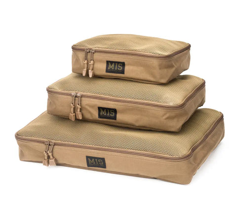 Three coyote brown, rectangular packing cubes of different sizes are stacked. Each MIS Organizer Set Cordura Nylon bag has a mesh top, double zipper, and front MIS label.