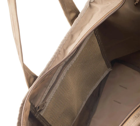 Close-up of the Super Tote Bag - Coyote Tan by MIS, showing the water-resistant 40L Cordura nylon interior with a zippered mesh pocket and fabric-lined main compartment for organized storage.