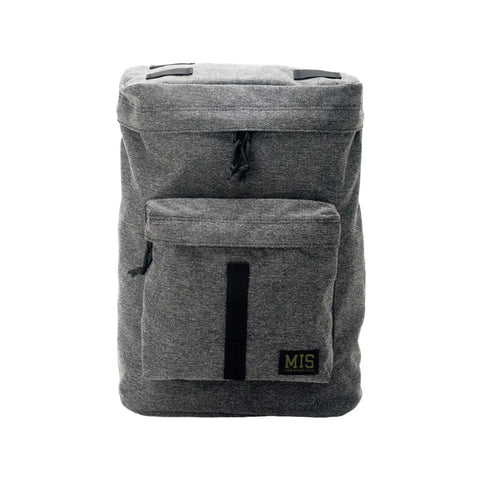 The MIS Backpack - Denim Grey features a rectangular Cordura Nylon build, large main compartment, padded laptop holder, front zip pocket, black zipper pulls, and a small MIS logo patch. Made in USA and shown on a white background.