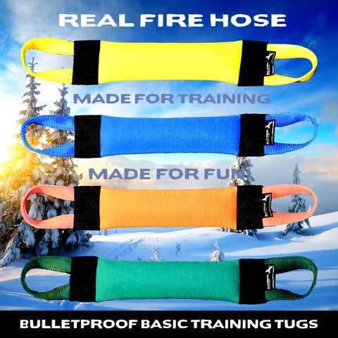Four colorful Basic Fire Hose Training Tugs by Bulletproof Pet Products Inc—yellow, blue, orange, and green—are shown against snowy mountains. These durable dog toys are perfect for training and play.