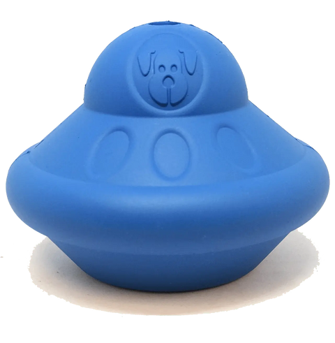 The Flying Saucer EDispenser by SodaPup is a blue, UFO-shaped rubber chew toy with an embossed cartoon dog face, designed as a durable treat dispenser for dogs.