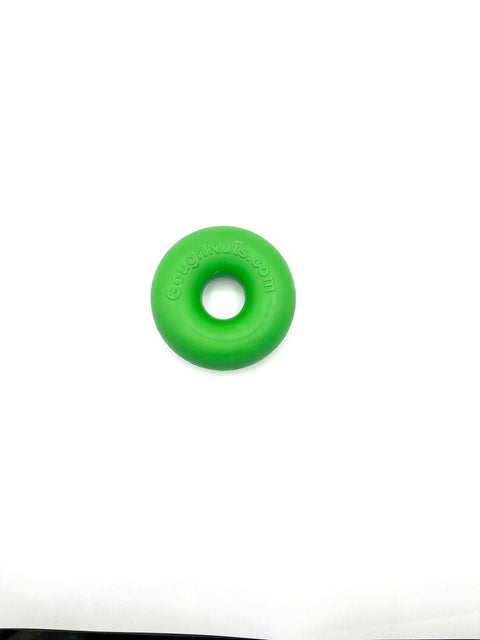 A Goughnuts Green Rings dog toy, shaped like a donut and made of natural rubber, is shown on a plain white surface.