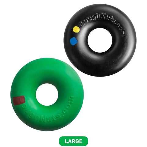 Two large Goughnuts Large Rings dog chew toys (for dogs 60-100 pounds), one black with yellow and blue dots, one green with a red dot, feature a special safety indicator. Shown on white background. Brand: Goughnuts.