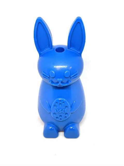The Bunny EChew Durable Nylon Chew and Enrichment Toy by SodaPup is a blue bunny-shaped dog toy with big ears, round eyes, and a small nose, holding a USA-marked circle. Its whistle mouthpiece sits atop its head—great for playful pups!.