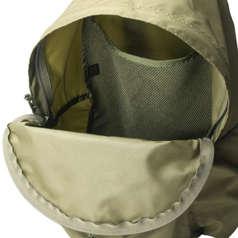 Close-up of the open top flap of the MIS Daypack - Olive Drab, made from water-resistant nylon. The inside mesh pocket, zipper compartment, and detailed stitching of this backpack are clearly visible.