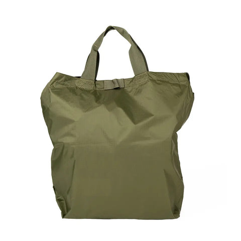 The MIS Carrying Bag Ripstop - Olive is a plain olive green tote with short handles, made from lightweight crinkled Ripstop Nylon, shown standing upright on a white background.