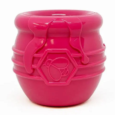 The SodaPup Honey Pot Durable PUP-X Rubber ECup Treat Dispenser & Enrichment Toy is a small, bright pink jar-shaped dispenser with a bee emblem on the front.