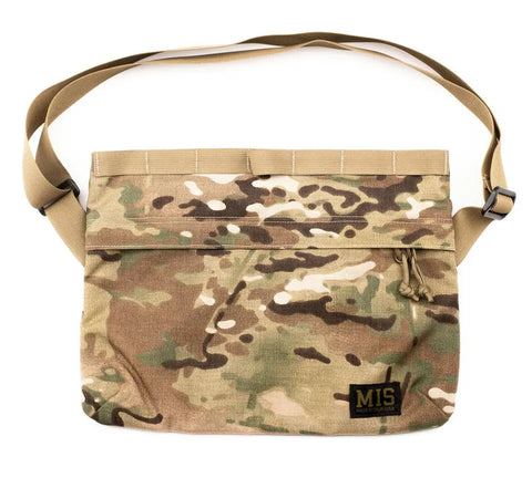 The MIS Padded Shoulder Bag - Multi Cam features a camouflage Cordura nylon design, adjustable tan strap, front zipper pocket, and a black MIS patch at the bottom right. Made in the USA.