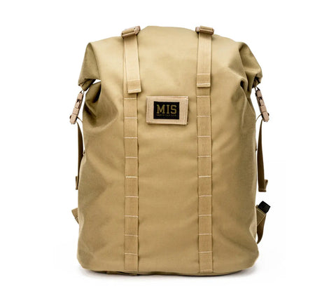 The MIS Roll Up Backpack in Coyote Tan features Cordura nylon, a top flap, front vertical straps, side buckles, and a black MIS patch on the front center. Made in the USA.