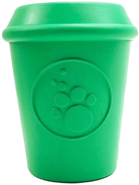 The SodaPup Coffee Cup EDispener is a green, durable rubber chew toy and treat dispenser with a raised paw print design, perfect for use as a slow feeder to encourage mindful sipping.