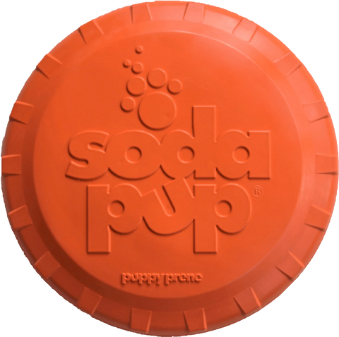 The Bottle Top Flyer Durable Rubber Retrieving Frisbee by SodaPup is a round, orange biodegradable dog toy shaped like a soda bottle cap and features the brand name embossed on top.