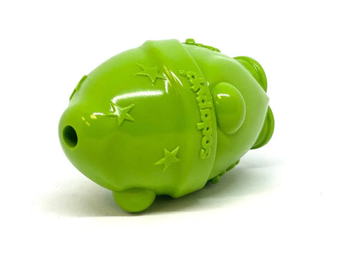 A green Gnome Durable PUP-X Rubber EDispenser Chew Toy & Treat Dispenser by SodaPup, featuring embossed stars and branding, lies horizontally on a white background.