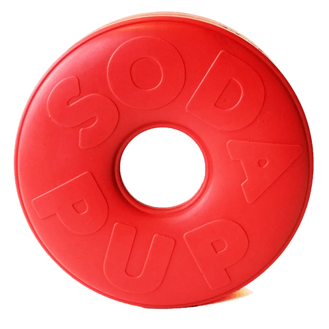 The SodaPup Life Ring EDispener is a durable red rubber chew toy shaped like a donut. Designed to dispense treats, it keeps your pup engaged and helps reduce problem behaviors. SODA PUP is embossed on the surface.