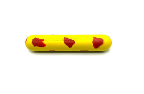 The Goughnuts Yellow Stick - Medium, a yellow cylindrical dog toy with irregular red spots for small breeds, is shown on a white background.