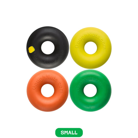 Four Goughnuts Small Ring Dog Toys (for dogs 10-40 lbs) in black, yellow, orange, and green are arranged in a square on a white background. A green box below displays “SMALL.” These durable toys are perfect for playful pups.