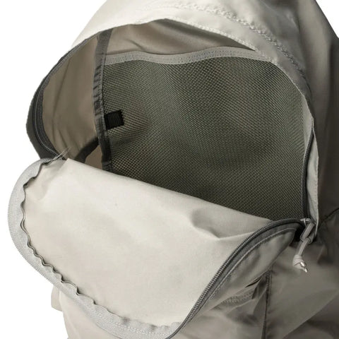 A close-up of the interior mesh lining and stitching inside a light gray hooded jacket—crafted with quality similar to the MIS Daypack - Foliage.