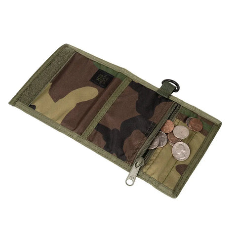 The MIS Folding Wallet - Woodland Camo, made in the USA, lies open to show a zippered coin pocket with assorted coins and two empty compartments.