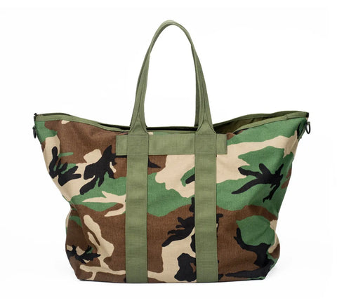 The MIS Super Tote Bag - Woodland Camo is a large, water-resistant Cordura Nylon tote with green handles and a green, brown, tan, and black camouflage pattern, shown on a white background.