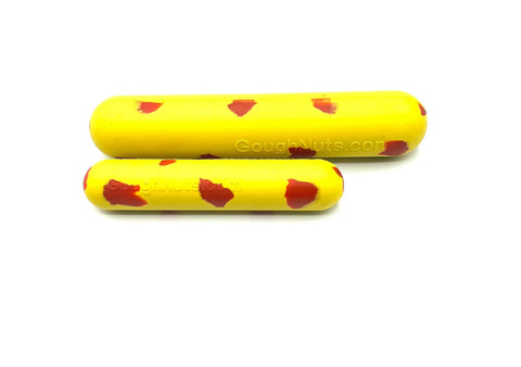 Two Goughnuts Yellow Stick - Small dog toys, yellow with red spots, sit side by side on a white background. One is larger than the other, ideal as indestructible toys for your pup or as a small-breed dog toy option.
