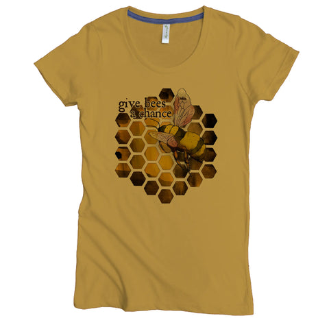 The Give Bees a Chance Graphic Tee by Spiritex | Sustainable Apparel is a mustard yellow women’s organic cotton shirt featuring a honeycomb pattern, bee graphic, and Give Bees A Chance text—perfect for bee lovers.
