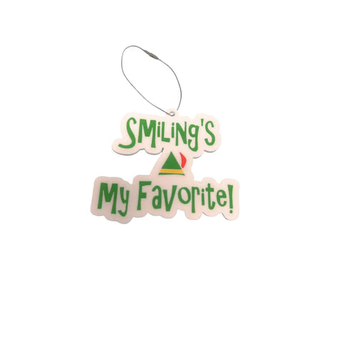 The Chatelet Manufacturing Elf Christmas Ornament features “Smilings My Favorite!” in green, a central Christmas tree design, and celebrates Buddy the Elf. Made in the USA—perfect festive décor for fans of Elf movie sayings.