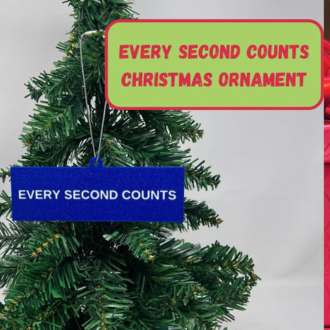 A small Christmas tree features a blue rectangular Chatelet Manufacturing ornament reading EVERY SECOND COUNTS. Above, a sign displays “Every Second Counts Christmas Ornament | Inspirational Holiday Ornament | Made in USA.”.