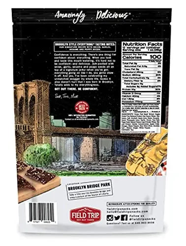 The back of a Field Trip Everything Bagel Beef Jerky 12oz package displays Brooklyn Bridge Park artwork, nutrition facts, product details, and social media info, with some gluten free jerky shown in the bottom left corner.
