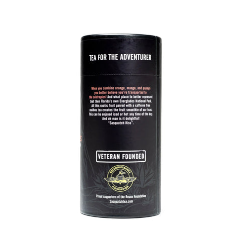 A cylindrical black tea container from Sasquatch Tea Co, labeled “Exotic Everglades (Rooibos Fruit Tea),” features “Veteran Founded,” supports the Rescue Foundation, and is inspired by Everglades National Park.