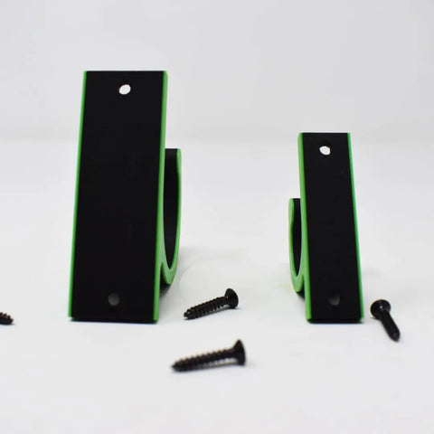 Two black and green Chatelet Manufacturing FRESHe Horizontal Fishing Rod Holders stand upright on a white surface, each with mounting holes. Three black screws are nearby. Made in the USA, these holders help keep your gear organized and secure.
